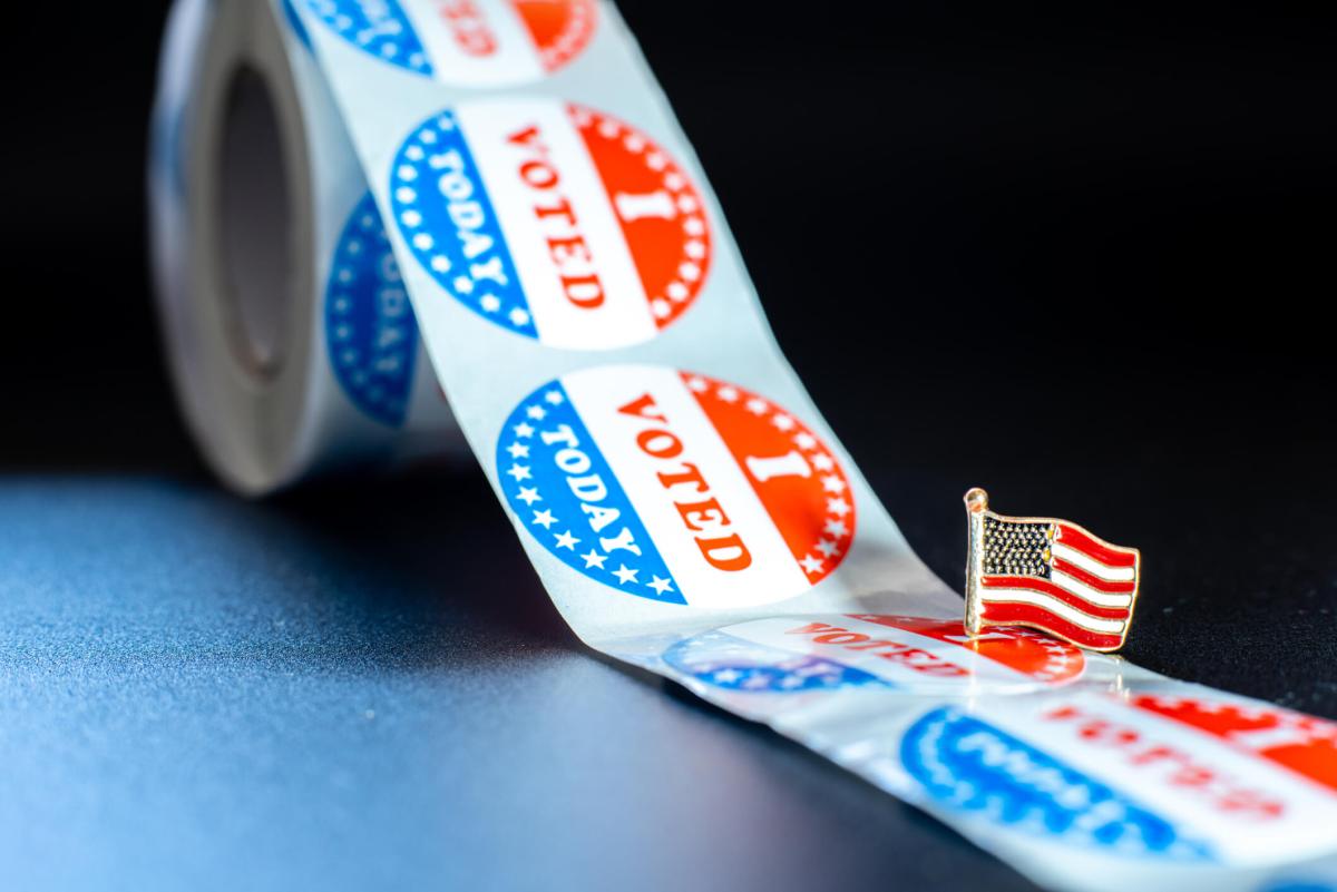 American flag on I voted today stickers, patriotic motive during the elections of the American president.