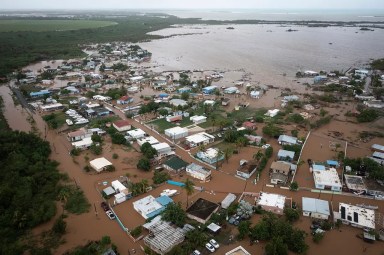 Homes are flooded on Salinas Beach after the passing of Hurricane Fiona in Salinas, Puerto Rico, Monday, Sept. 19, 2022.