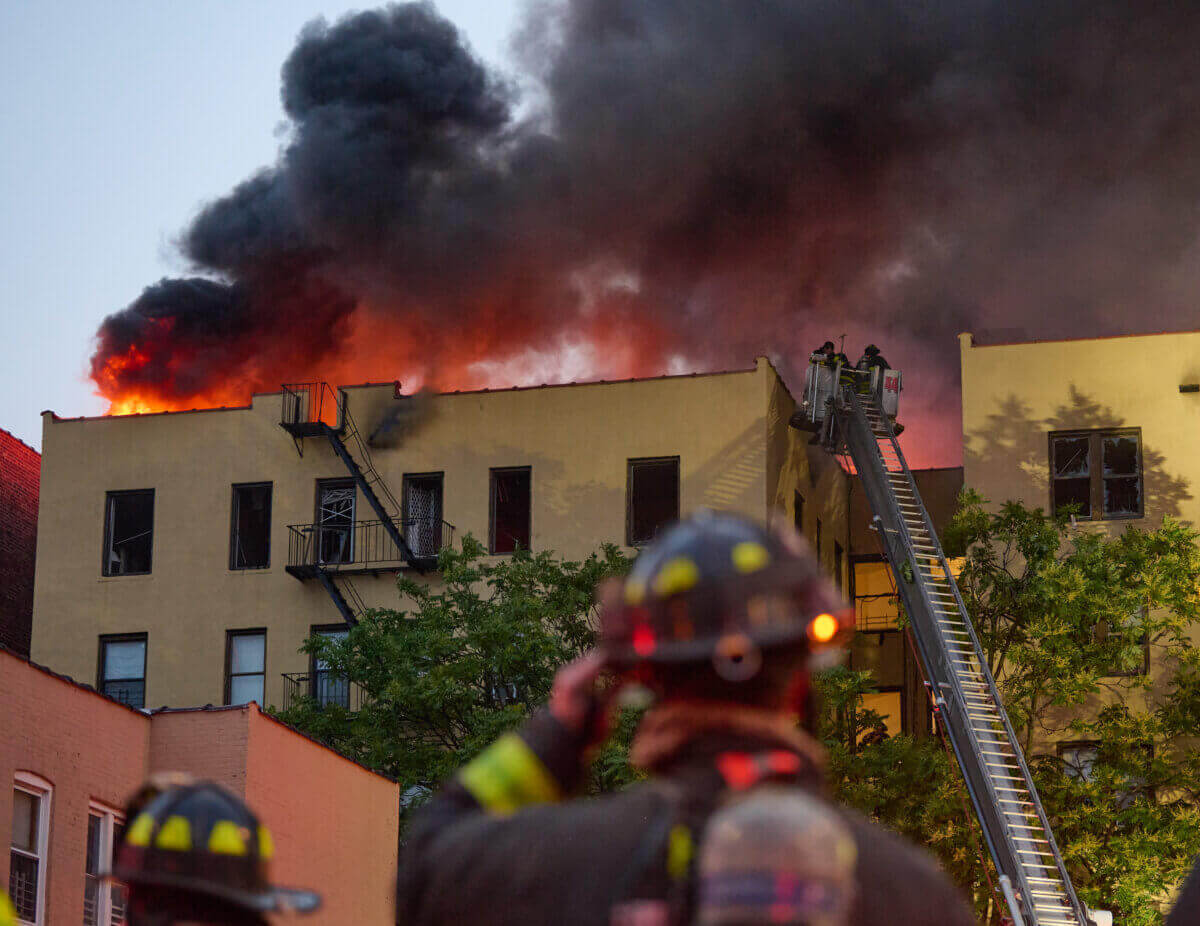 Another fire on Sunday killed one woman in the Bronx. Pictured, firefighters attempt to control a fire in the Soundview section on Sunday.