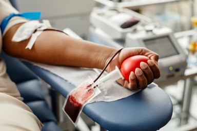 Young Woman Giving Blood Closeup