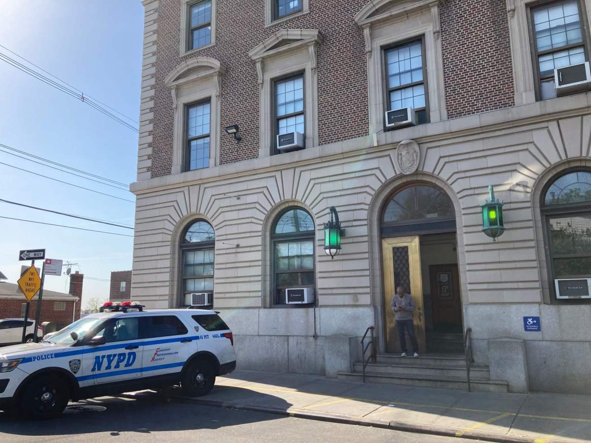 Police cars are parked outside the 45th Precinct in Throggs Neck on April 21, 2023.