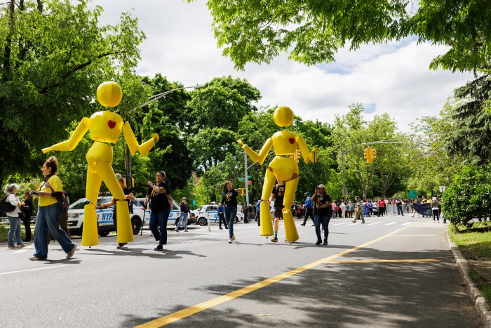 People make their way up Mosholu Parkway during the annual Bronx Week parade on Sunday, May 19, 2024.