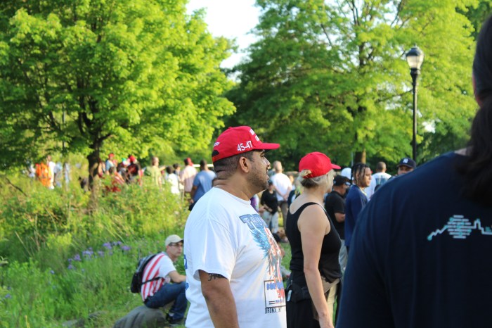 People listen outside former President Donald Trump's campaign rally in the Bronx's Crotona Park on Thursday, May 23, 2024.
