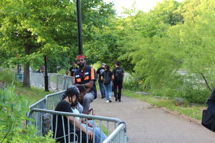 People livestream former President Donald Trump's campaign rally speech in the Bronx's Crotona Park on Thursday, May 23, 2024.