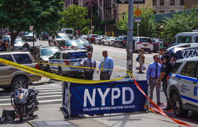Authorities gather around the scene of a deadly accident that killed a teenage girl in the Bronx on Tuesday, May 28, 2024.