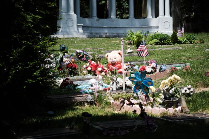 An American flag honoring a veteran stands in a sea of gifts for much loved family members on May 20, 2024.