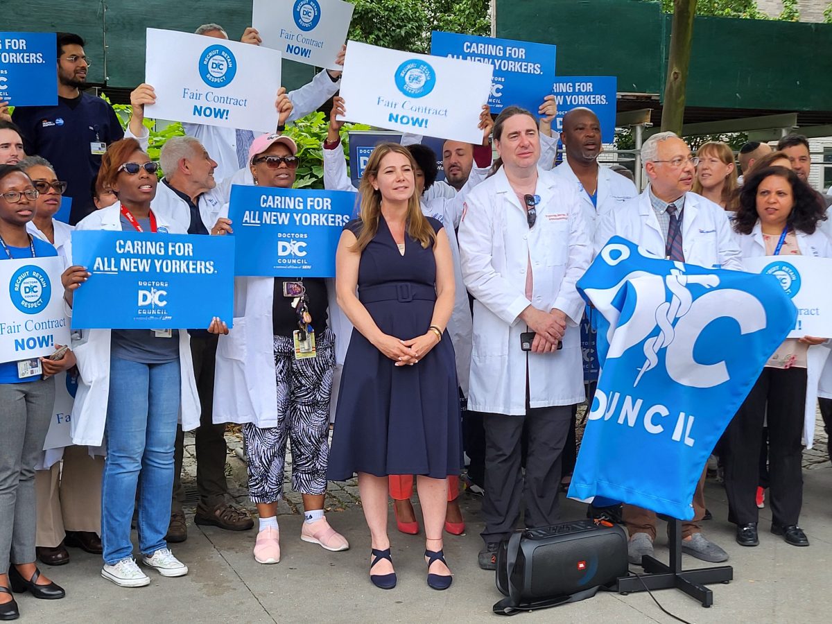 Council Member Kristy Marmorato (center in navy dress) joined dozens of physicians who rallied outside Jacobi Medical Center on June 14, 2024 to demand a better contract.