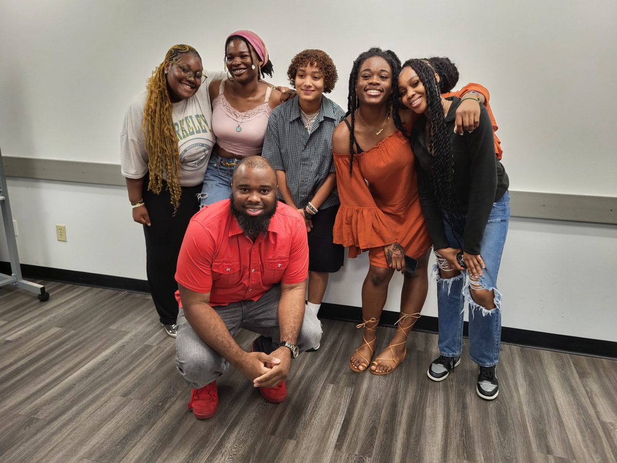 Kevin Benoit, founder of Parle Endeavors, with the winners of the Bronx preliminary round of the second annual Teen Poetry Slam on June 15, 2024. Four of the five teens are from the Bronx.