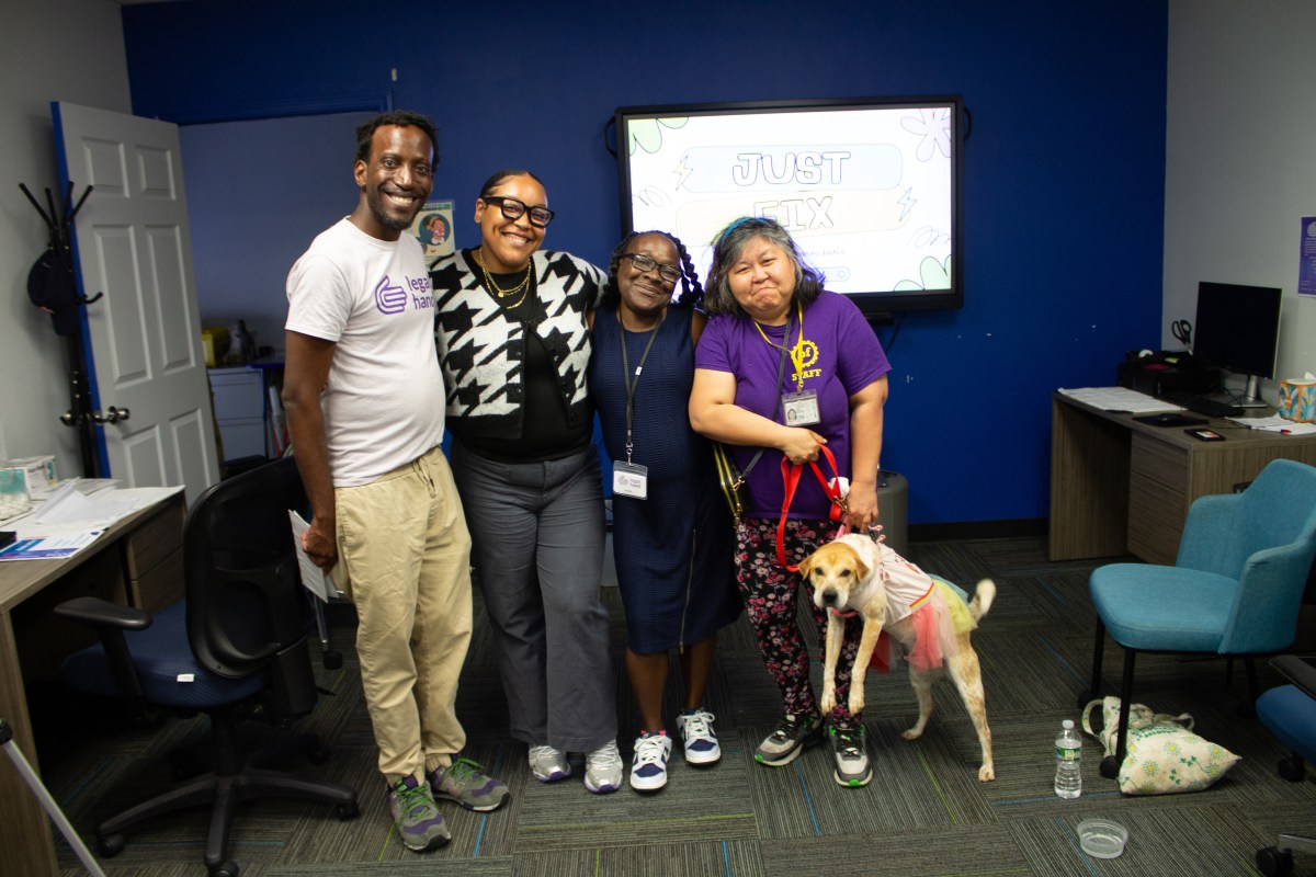 From left, James Coger, Manager of Legal Hand Bronx, Andrianelys Parra, Program Associate at Legal Hand Bronx, Sonra Lee, Legal Hand Bronx Volunteer, and attendee Hannah Josiah gather for a post-workshop group photo. Photo Jewel Webber.