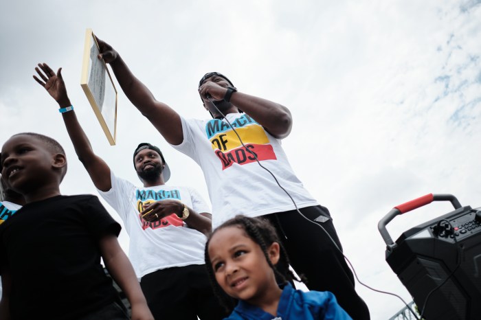 Leaders of the Dad Gang hold up a citation of merit given by Bronx Borough President Vanessa Gibson on June 29, 2024. The event, held by Dad Gang, aims to support Black fatherhood and break stereotypes about fatherhood in the Black community.